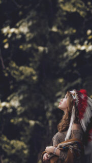 Stunning Portrait of a Woman in Native American Headdress Mobile Wallpaper
