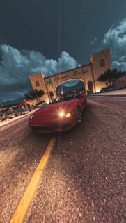 Stunning Red Mitsubishi 3000GT Under Heroica Mulege Arch at Night Wallpaper