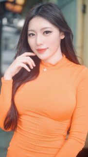 Beautiful Young Woman in Vibrant Orange Turtleneck High Quality Portrait Wallpaper