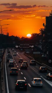 Breathtaking Sunset Highway Traffic View Mobile Wallpaper for Smartphone