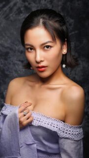Elegant Young Woman in Lavender Off Shoulder Top Portrait Wallpaper