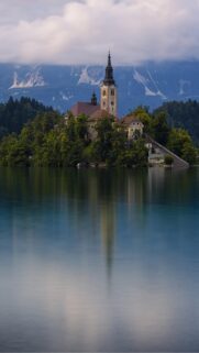 Breathtaking Lake Bled Church and Mountain Reflection Wallpaper for Mobile