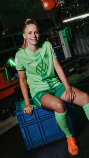 VfL Wolfsburg Female Football Player in Neon Green Kit Wallpaper