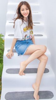 Beautiful Smiling Girl Sitting on White Stairs Wallpaper for Mobile