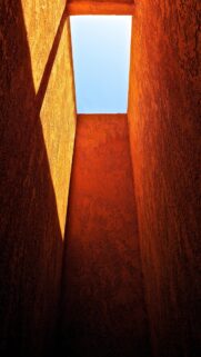 Minimalist Orange Architectural Light Tunnel Wallpaper for Mobile Screens