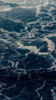 Stunning Aerial View of Frozen Lake and Cracked Ice Patterns Wallpaper