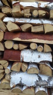 Rustic Stacked Birch Wood Logs High Resolution Mobile Background