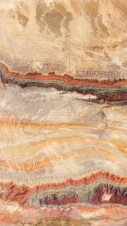 Stunning Aerial View of Colorful Desert Geological Formations Mobile Wallpaper