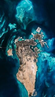 Breathtaking Satellite View of Bahrain Island Surrounded by Azure Ocean Waters Wallpaper