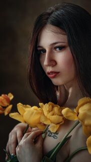 Beautiful Woman Holding Yellow Tulips Aesthetic Portrait Wallpaper for Mobile