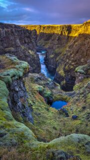Stunning Icelandic Canyon Landscape with Mossy Cliffs and Blue River Wallpaper