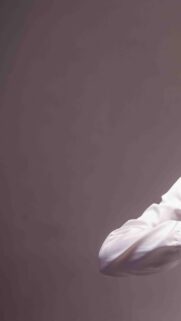 Minimalist White Shirt Sleeve on Grey Background Mobile Wallpaper