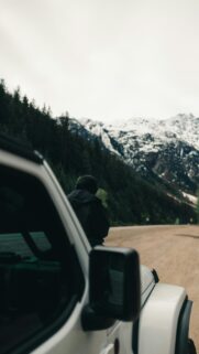 Solitary Adventurer by Snowy Mountains White Jeep Phone Wallpaper