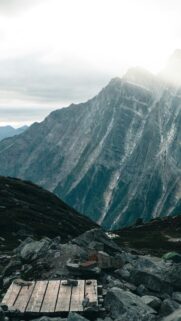Majestic Mountain Peak with Wooden Hiking Trail Phone Wallpaper