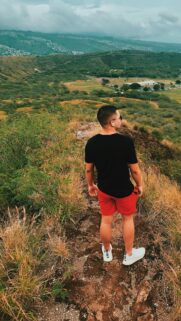 Man Hiking Overlooking Hawaii Valley Scenic View Phone Wallpaper