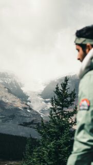 Stunning Mountain Glacier and Adventurer Silhouette Mobile Wallpaper