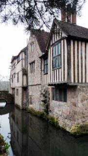 Ancient Timbered Manor House Manifestation and Home Stability Wallpaper