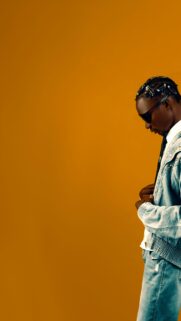 Stylish Man in Denim with Safety Pin Hair Accessories Phone Wallpaper