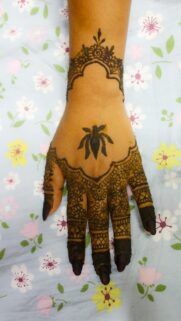 Elegant Henna Hand Art with Traditional Floral Patterns Wallpaper