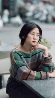 Asian Girl Wearing Stylish Striped Sweater Aesthetic Mobile Wallpaper