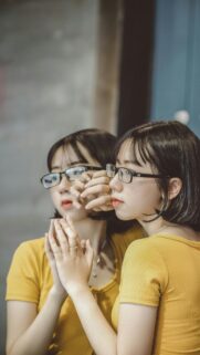 Reflective Beauty Asian Girl in Yellow Top Aesthetic Mobile Wallpaper