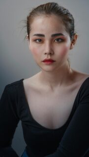 Stunning Portrait of an Asian Woman in Black Professional High-Quality Wallpaper