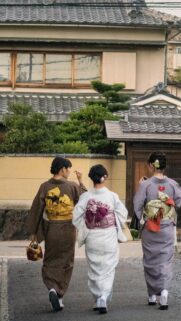 Three Women in Traditional Japanese Kimonos Walking in Kyoto Wallpaper