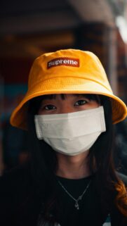 Asian Girl Wearing Supreme Yellow Bucket Hat Phone Wallpaper