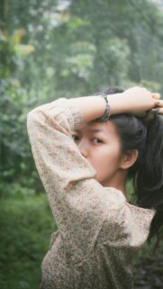 Beautiful Young Woman with Floral Blouse Mobile Phone Wallpaper