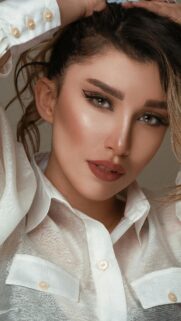 Stunning Portrait of a Woman with Elegant Makeup Phone Wallpaper