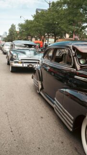 Vintage Chevrolet Classic Cars Cruising in the City Street Wallpaper
