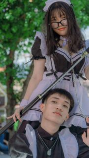 Maid Cafe Cosplay Duo with Katana Aesthetic Mobile Wallpaper