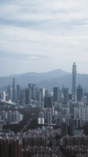 Breathtaking Shenzhen Cityscape Skyscrapers Mountain View Wallpaper