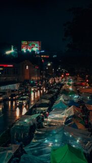 Night City Street Market with Glowing Tents Mobile Wallpaper