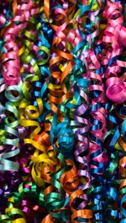 Vibrant Multicolored Curly Gift Ribbon Festive Abstract Wallpaper