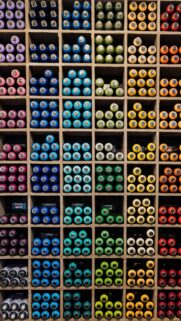 Vibrant Spray Paint Can Collection Organized Grid Wallpaper