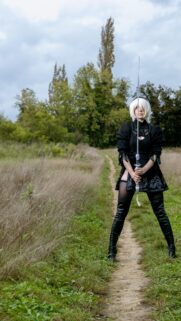 Stunning 2B Cosplay Standing on a Path Mobile Phone Wallpaper
