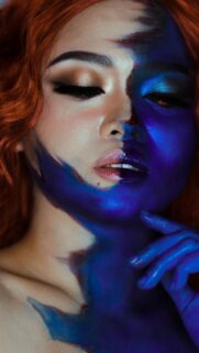 Stunning Mystic Half-Face Blue Body Paint Art Mobile Wallpaper