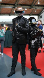 Daft Punk Cosplay Duo in Shimmering Sequin Suits Wallpaper