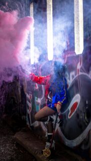 Harley Quinn Cosplay with Pink Smoke Graffiti Street Mobile Wallpaper