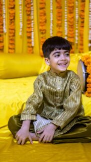 Happy Little Boy in Traditional Kurta Festive Celebration Wallpaper