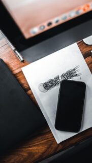 Creative Office Desk with Stationery and Smartphone Phone Wallpaper