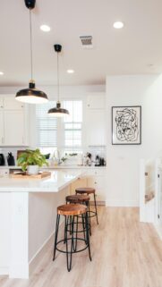 Modern Minimalist Kitchen Interior with Wooden Bar Stools Wallpaper