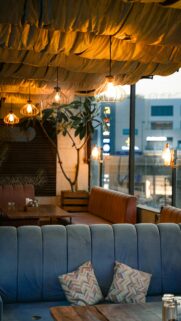Cozy Rooftop Restaurant Lounge With Warm Hanging Lights Wallpaper