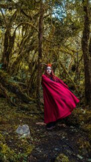 Mystical Horned Sorceress in Red Cloak Fantasy Forest Wallpaper