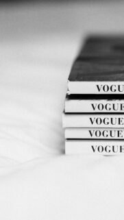 Minimalist Vogue Magazine Stack Black and White Aesthetic Wallpaper