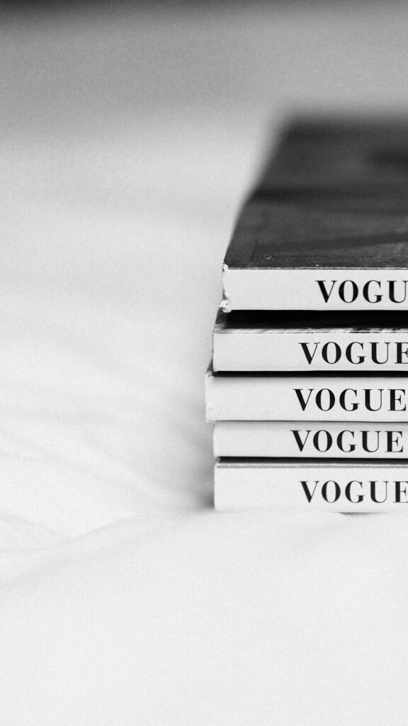 Minimalist Vogue Magazine Stack Black and White Aesthetic Wallpaper