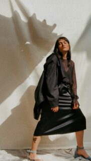 Chic Fashion Photography with Dramatic Light and Shadows Wallpaper
