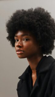 Stunning Portrait of Young Woman with Natural Afro Hairstyle Wallpaper
