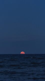 Stunning Blood Moon Rising Over Ocean Spiritual Energy Phone Wallpaper